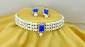 Alloy gold plated white jewel set with large blue stone | MANATH