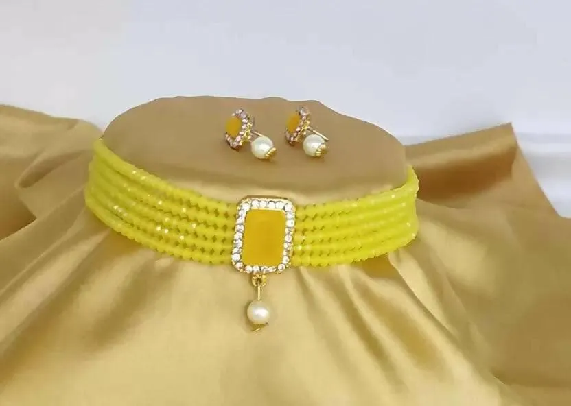 Alloy gold plated white jewel set with large blue stone | MANATH