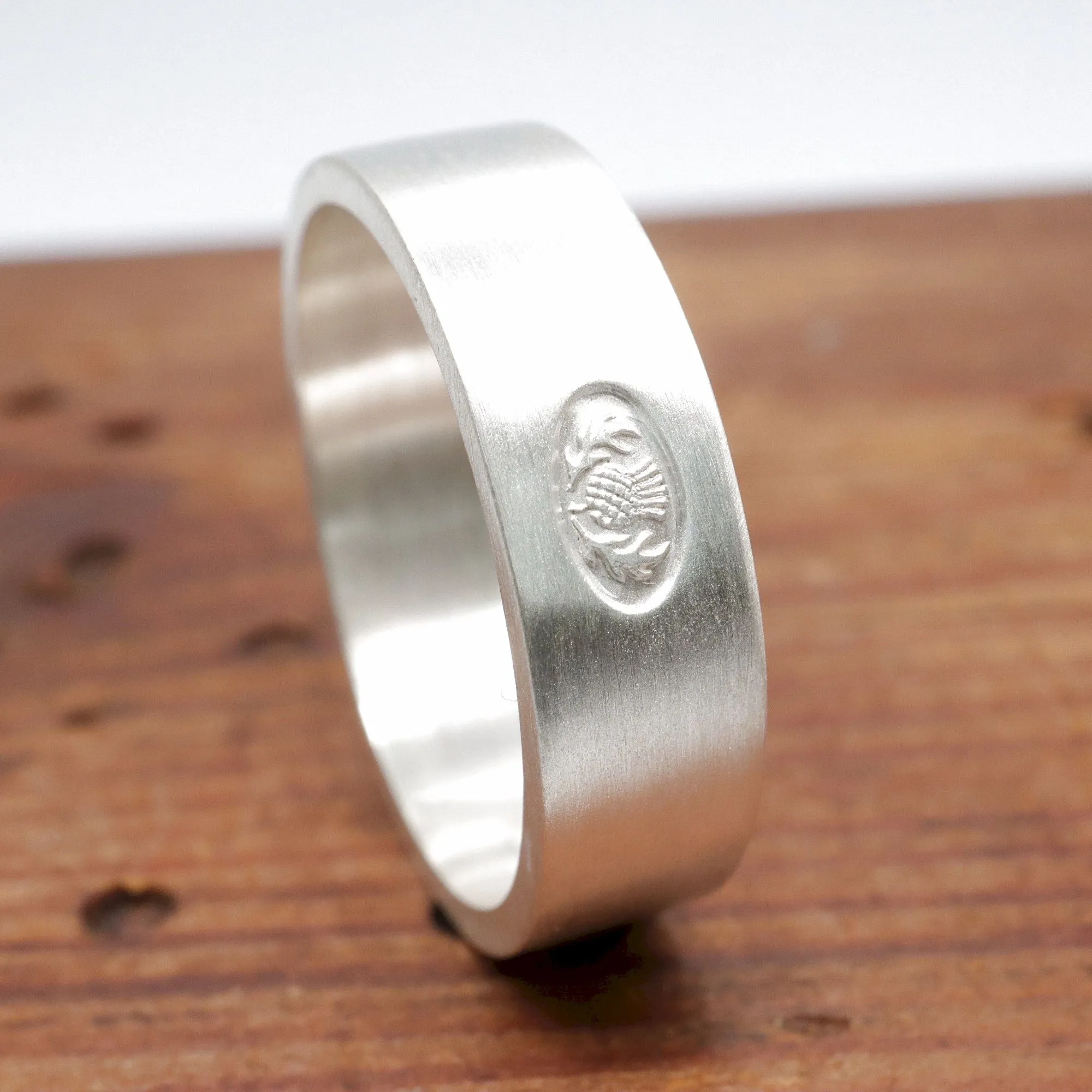 Scottish flat brushed matte white gold wedding ring.